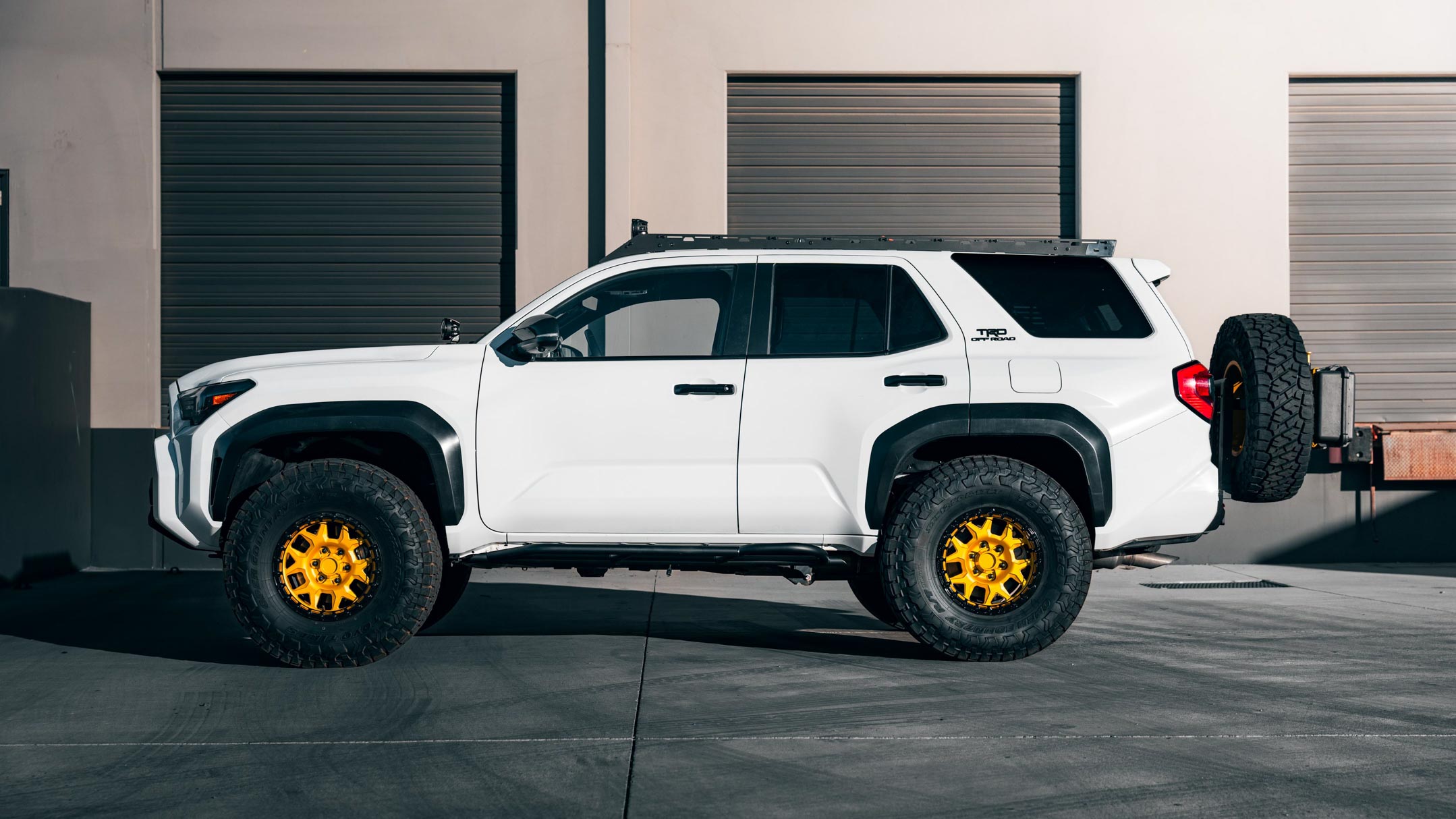 A beautiful new, 6th generation, 2025 toyota 4runner with aftermarket parts by westcott designs that look stock.